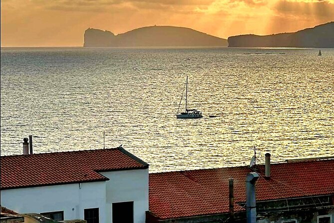 2-hour sunset tour by sailboat with aperitif. - Muralla de l’Alguer Vella: the moment the engine goes quiet