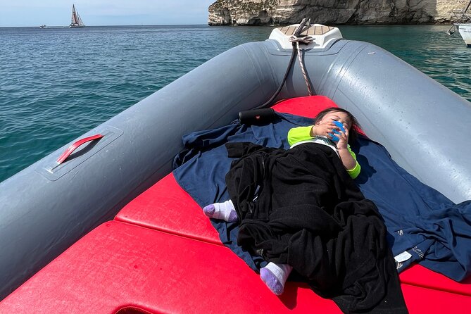 3 Hours Guided Dinghy Tour: Cagliari, Caves and Sella del Diavolo - Sella del Diavolo Cove: Turquoise Water Under a Dramatic Rock