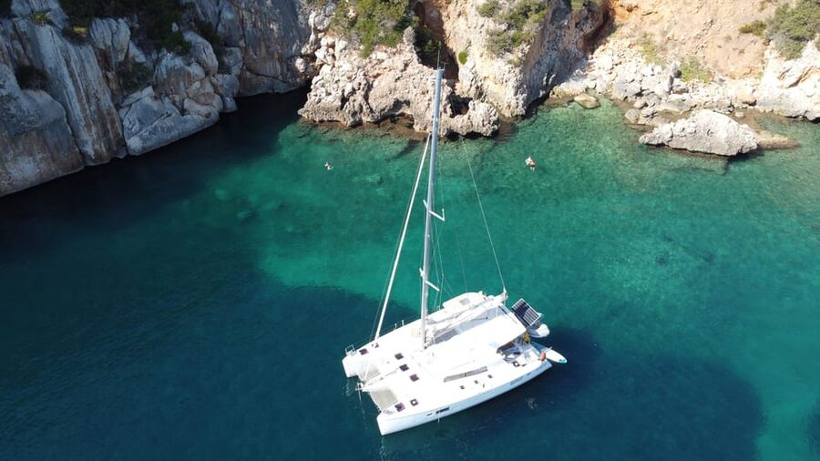 Alghero catamaran sunset tour Alghero - La Maddalenetta anchorage: swimming, snorkeling, and SUP time