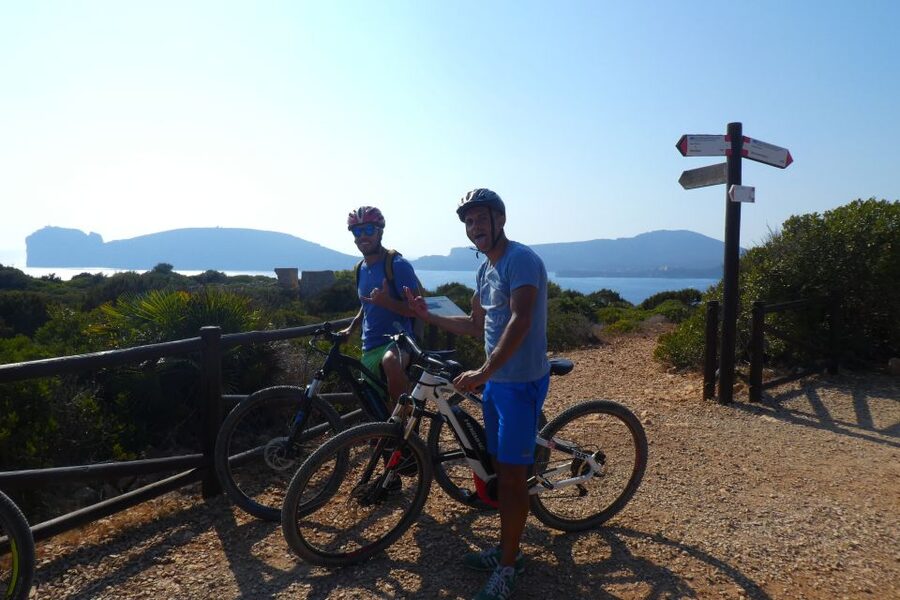 Alghero: Small Beaches E-Bike Tour with Aperitivo - Riding Into Porto Conte Regional Park: What the Start Feels Like