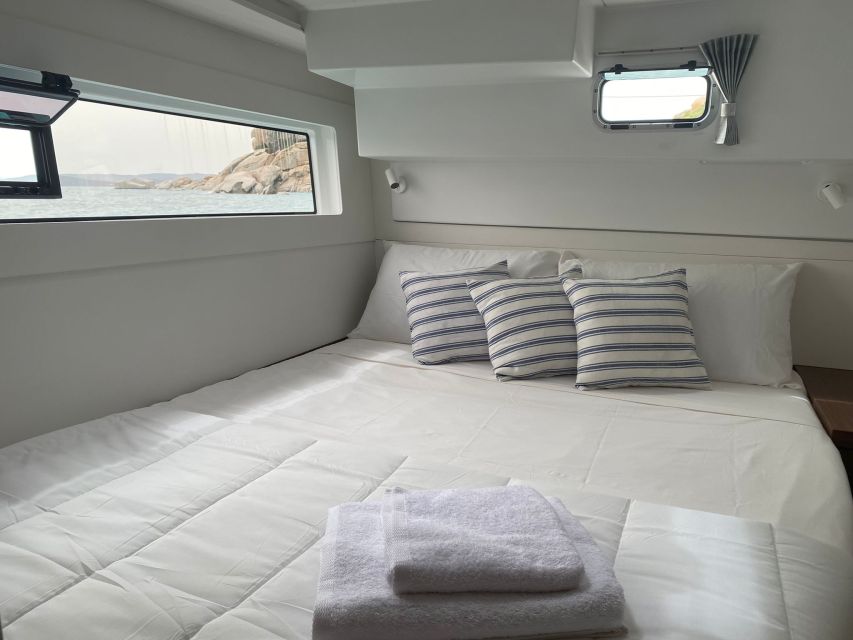 Archipelago di La Maddalena: Catamaran Tour Full day-Lunch - La Maddalena National Park: aperitif, swimming, snorkeling, and SUP (the big centerpiece)