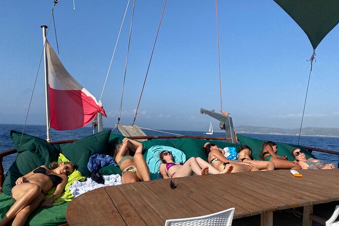 Boat tour of San Pietro Island - The Momo boat experience: comfort and local food, not just sightseeing