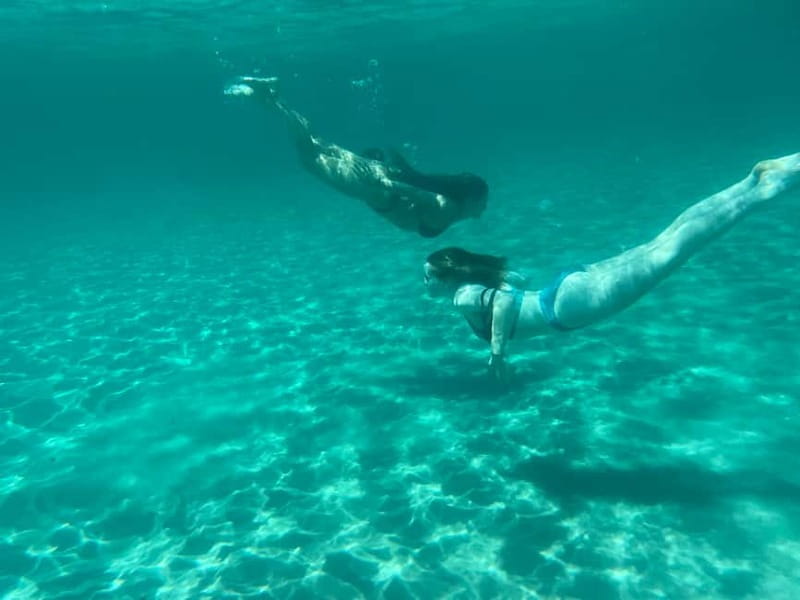 Cagliari: Boat Tour with 4 Swim Stops, Snorkeling & Prosecco - The “in-between” sights: Grotta dei Colombi, plus the coastline return