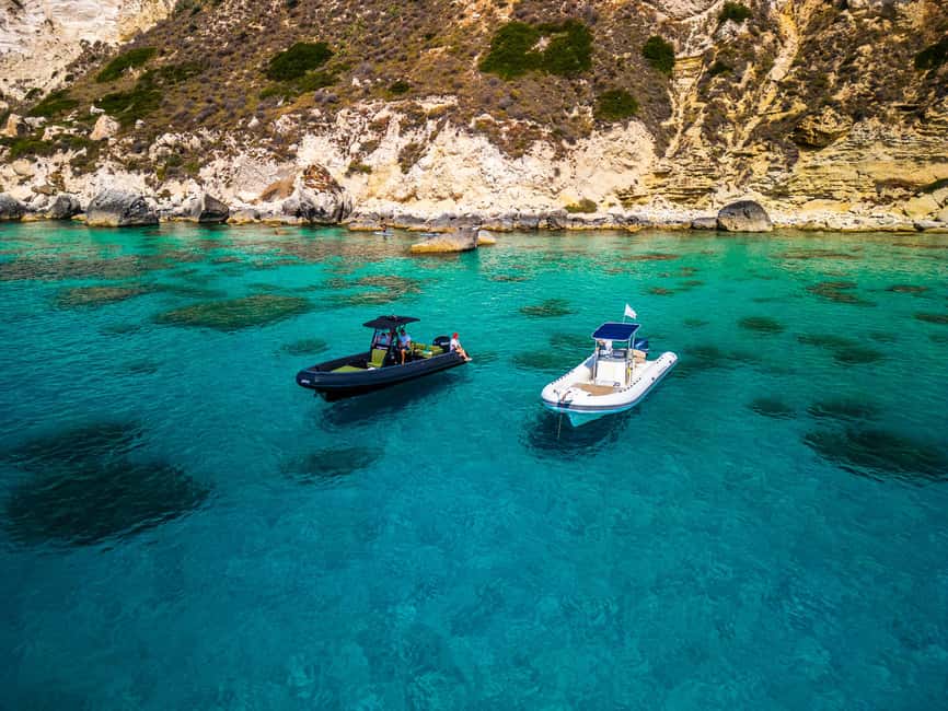 Cagliari: Coastline Cruise with Drinks and Snorkeling - The boat and skipper vibe around Marina del Sole