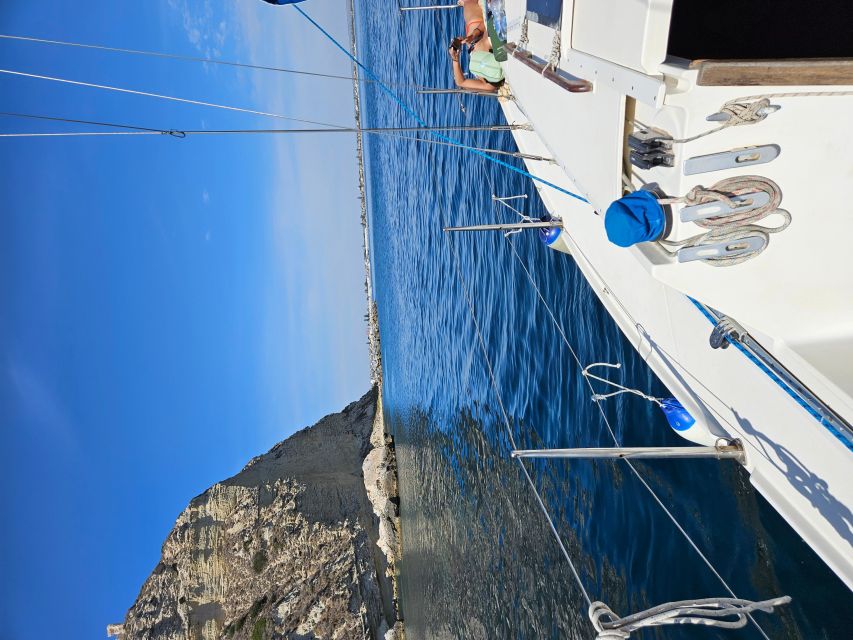 Cagliari: Devil's Saddle Sailboat Tour, Snorkeling and Drink - Snorkeling in natural pools with real fish time