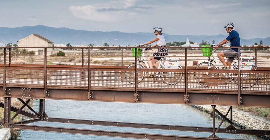 Cagliari: Electric Bike Nature Tour - Terramaini canal bike lane and the City of Salt scenery shift