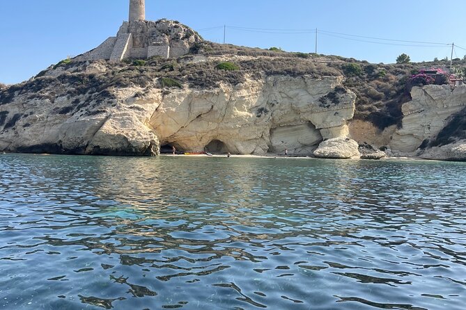 Cagliari Gulf Boat tour : 5 stops, snorkeling & local aperitif - Calamosca Beach: emerald-green tones and the tall landmark
