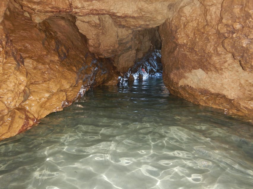 Cagliari: Sella del Diavolo and Caves Boat Tour - Torch-Lit Caves and Snorkel Time in Crystal Water