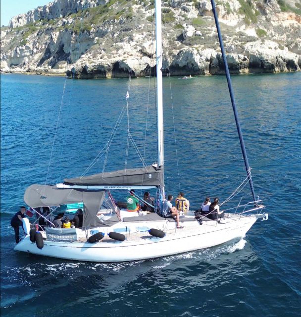Cagliari: Tour in barca 4 soste tuffi Snorkeling e Prosecco - Stop 1: Cala Bernat for the First Real Swim