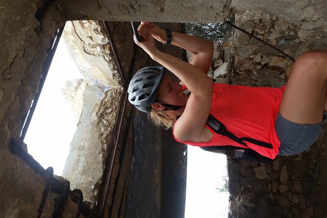 E-bike Excursion at Natural Park of Porto Conte - Punta Giglio - E-MTB Adventure - Punta Giglio: wartime ruins hidden in limestone and camouflage