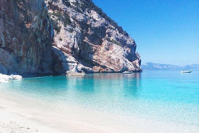 From Cala Gonone: Dinghy trip in the Gulf of Orosei - Stop 4: Cala Sisine for the bigger cove feel and pebble footing