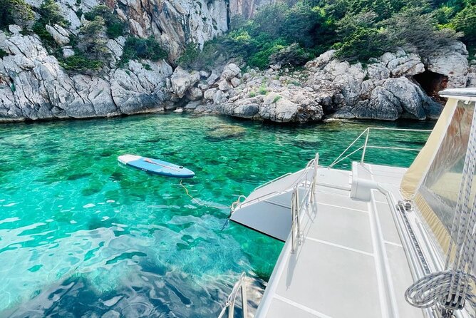 Full day Catamaran cruise in Porto Conte Natural Park - Onboard life: food, wine, snorkeling gear, and a real host