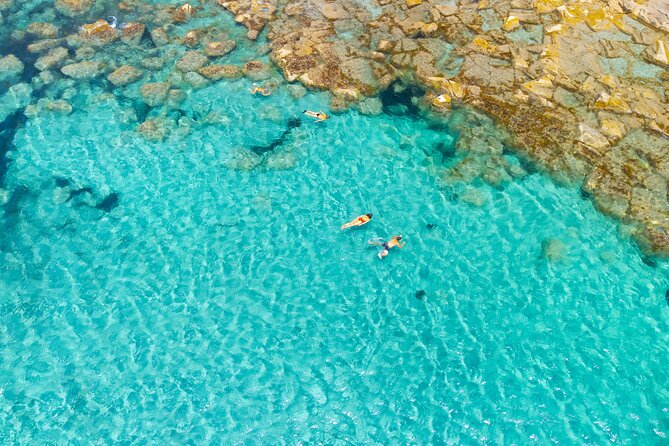 Guided day by boat in Carloforte with snorkelling and aperitif - The San Pietro cove stop: where the day turns into swimming time