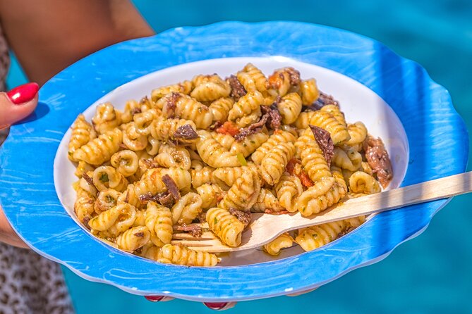 Guided day by boat in Carloforte with snorkelling and aperitif - Punta Delle Colonne: quick photos, real drama