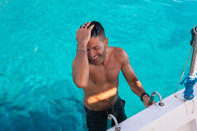 Guided day by boat in Carloforte with snorkelling and aperitif - Capo Sandalo and the lighthouse cliff: nature meets scenery