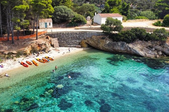Kayak tour with aperitif and dolphins - Cala Moresca coves: where you paddle, then stop for swim-and-snorkel