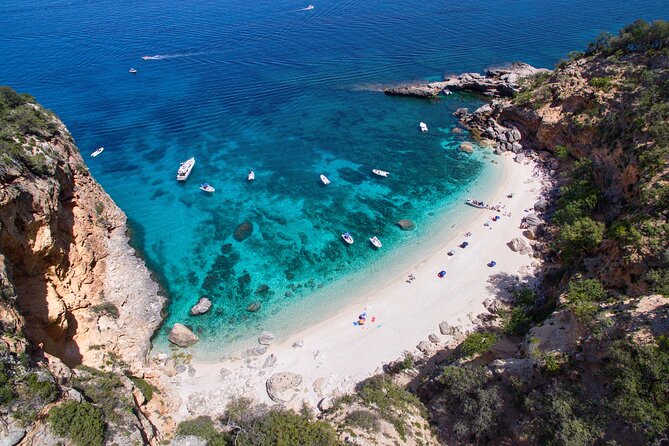 One day guided boat tour along the Baunei coast. - Cala Mariolu: your first real swim-and-snorkel block plus a coffee kiosk
