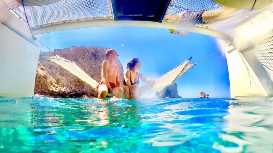 Porto Conte: Half-day catamaran tour with aperitif - Cala Dragunara: your swim-and-anchored-play stop