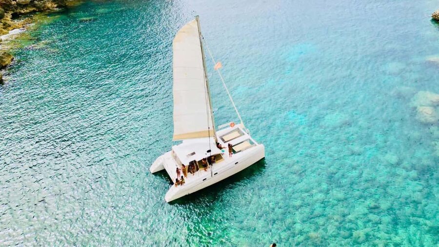 Porto Conte: Sunset catamaran excursion with aperitif - Capo Caccia viewpoints and what to watch for