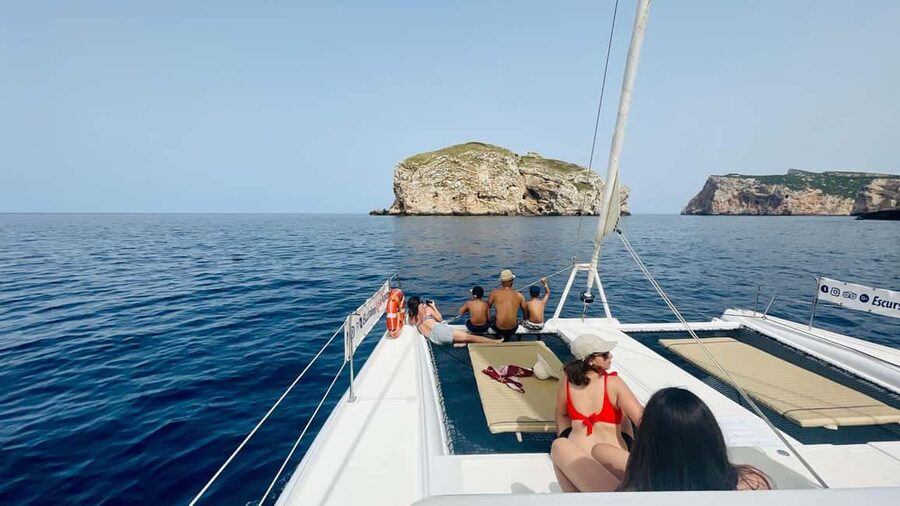Porto Conte: Sunset catamaran excursion with aperitif - Cala Bramassa at golden hour: swim, snorkel, and breathe easy