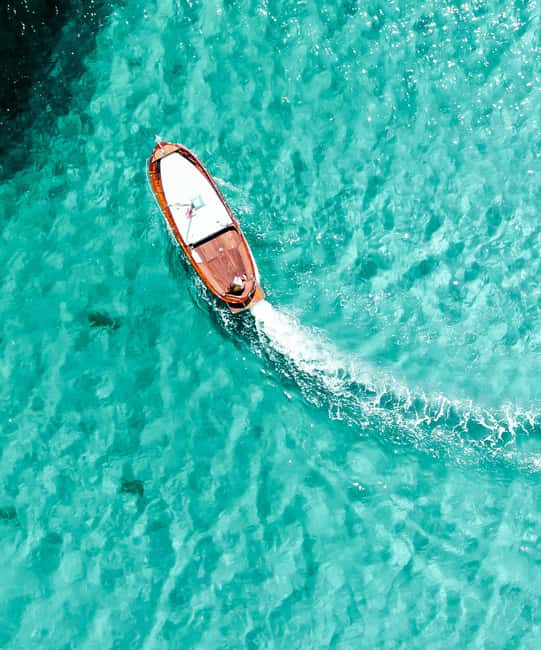 Porto San Paolo: Half Day Boat Tour to Tavolara and Molara - The Boat Experience: Classic Comfort Beats the Crowds