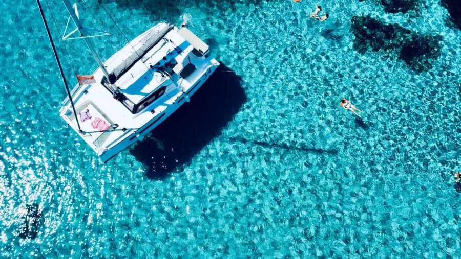 Stintino: Half-day catamaran tour to La Pelosa with aperitif - La Pelosa swim: the iconic beach angle you actually want