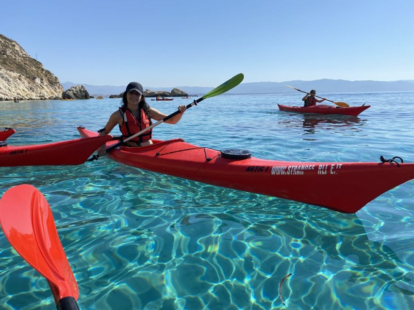 Sunset kayak tour Sella del diavolo - Launching from Calamosca: red kayaks, quick orientation, real sea air