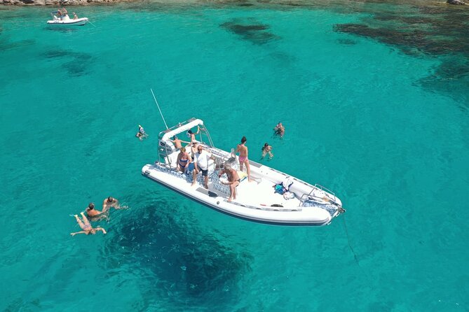 Tavolara San Teodoro's 5 Island and Beach Tour - Tavolara Island caves, Eye of God views, and the protection boundary
