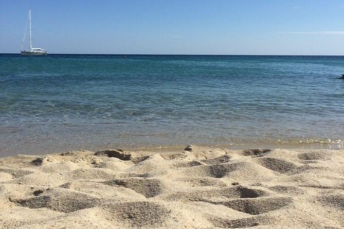 Tour of the beaches in Villasimius - Simius Beach: Long White Sand, Semicircle Bay, and Wind-Sheltered Swimming